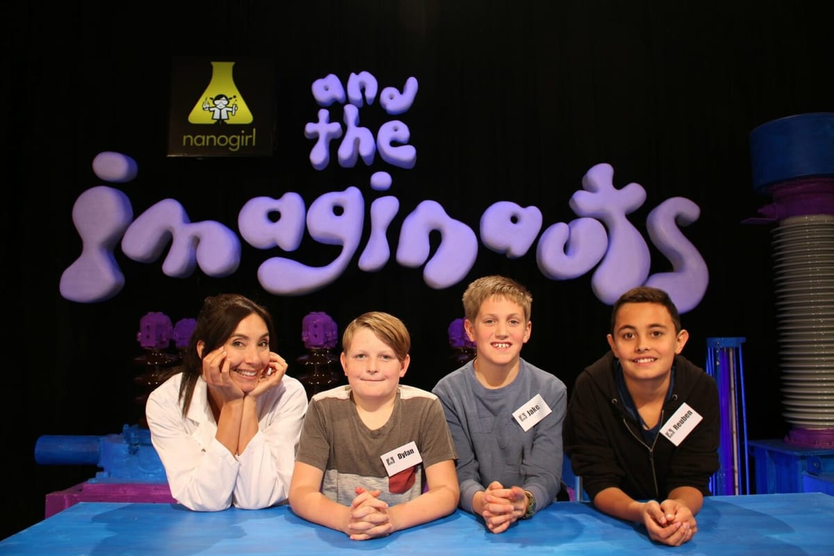 Dr Michelle Dickinson on the set of the television series Nanogirl and the Imaginauts with three children